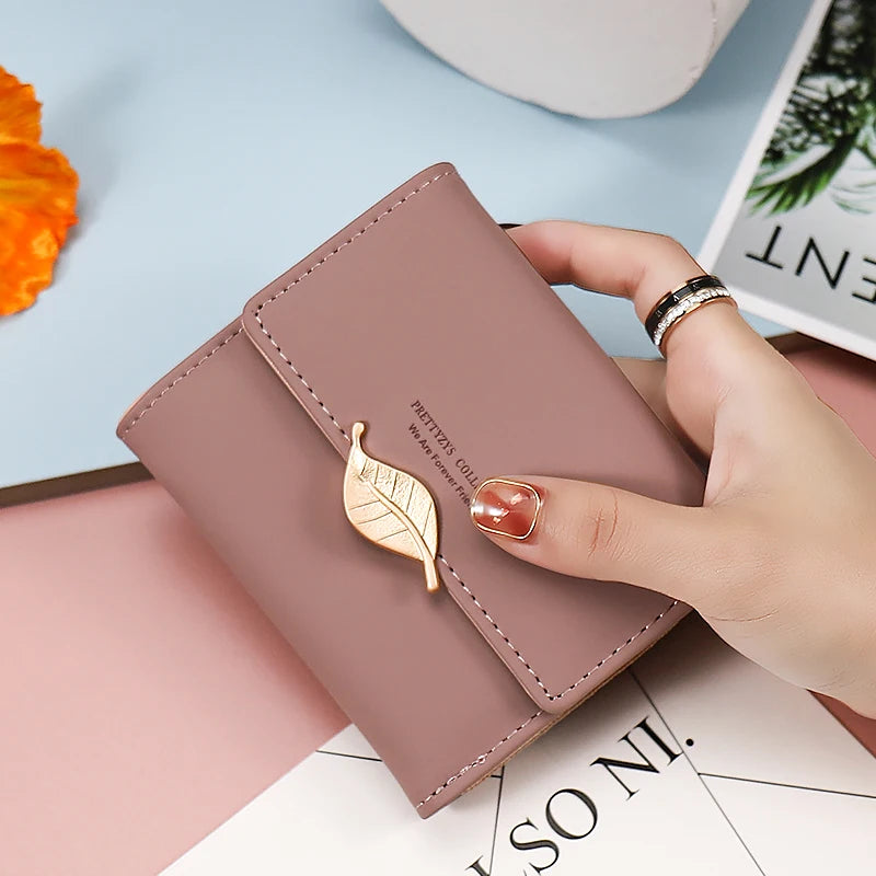 2024 Purse women's short high-end boutique fashion personality hardware leaf buckle short three fold bag multi-card folding stud