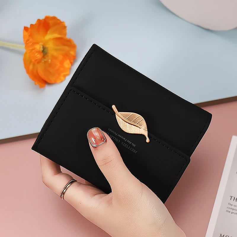 2024 Purse women's short high-end boutique fashion personality hardware leaf buckle short three fold bag multi-card folding stud