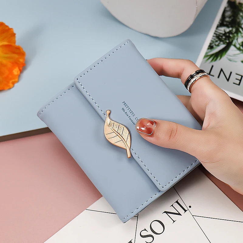 2024 Purse women's short high-end boutique fashion personality hardware leaf buckle short three fold bag multi-card folding stud
